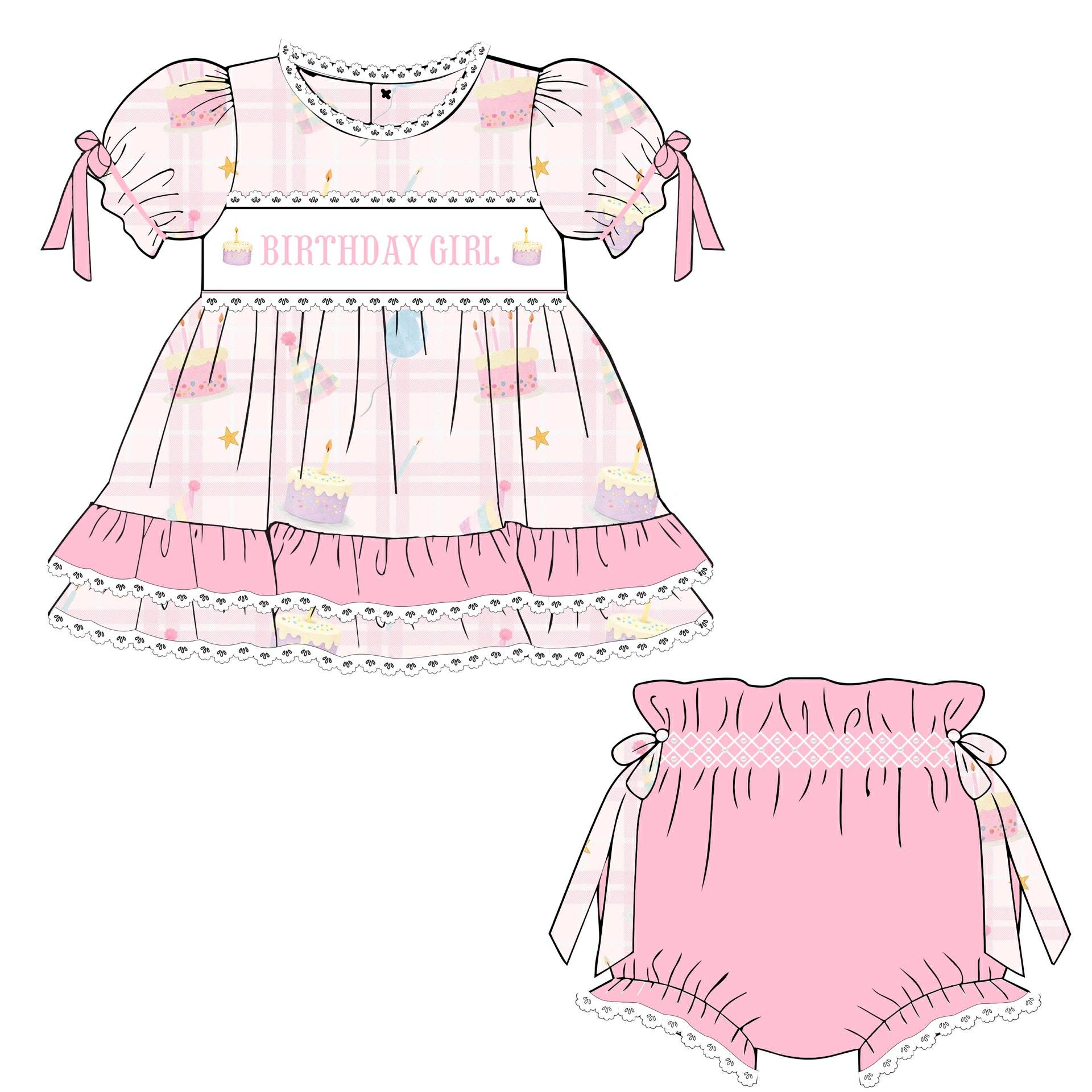 Children's pink dress with 'Birthday Girl' text and matching bloomers on a white background